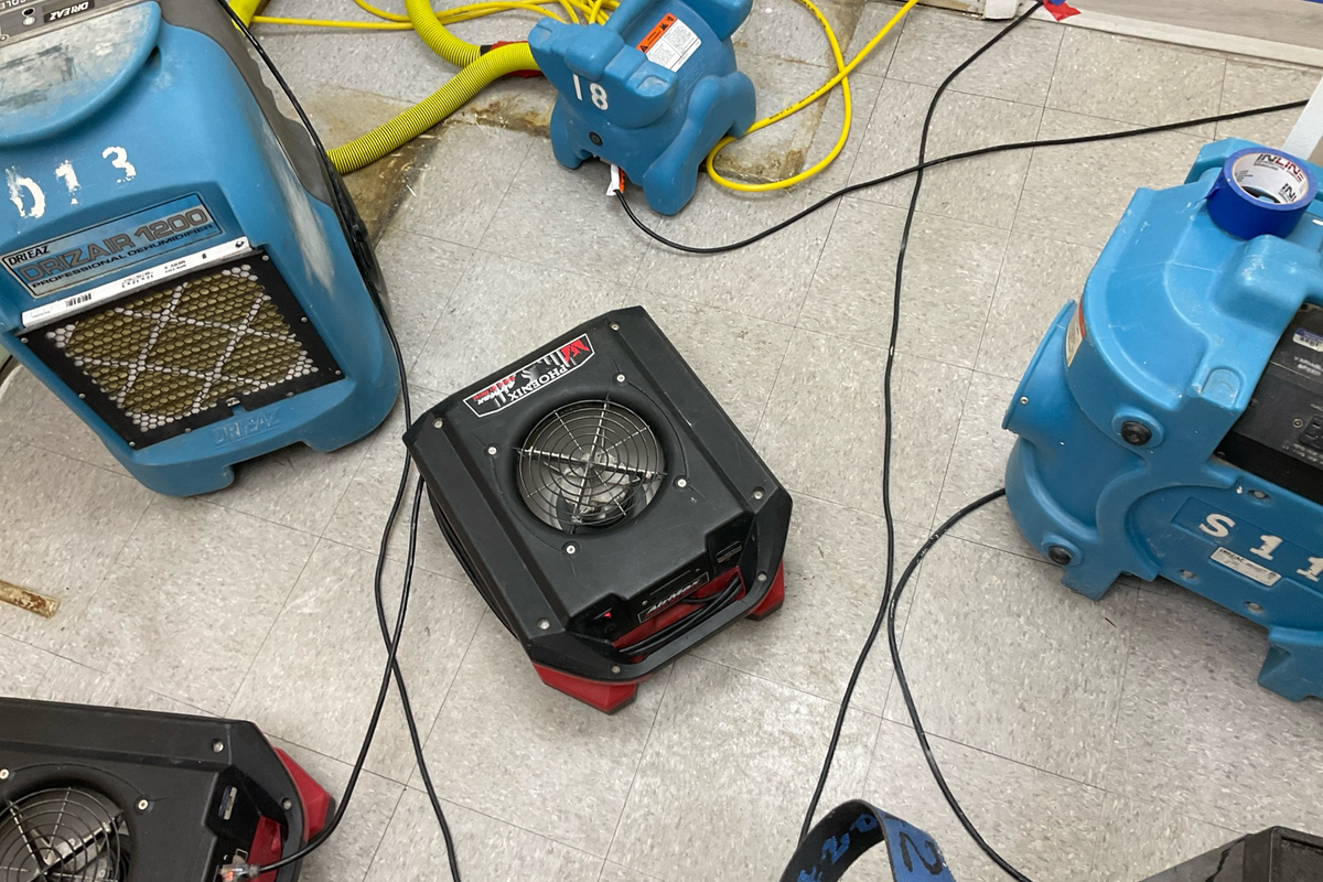 Professional water damage restoration equipment including industrial dehumidifiers, air movers, and moisture detection tools used by BestDry