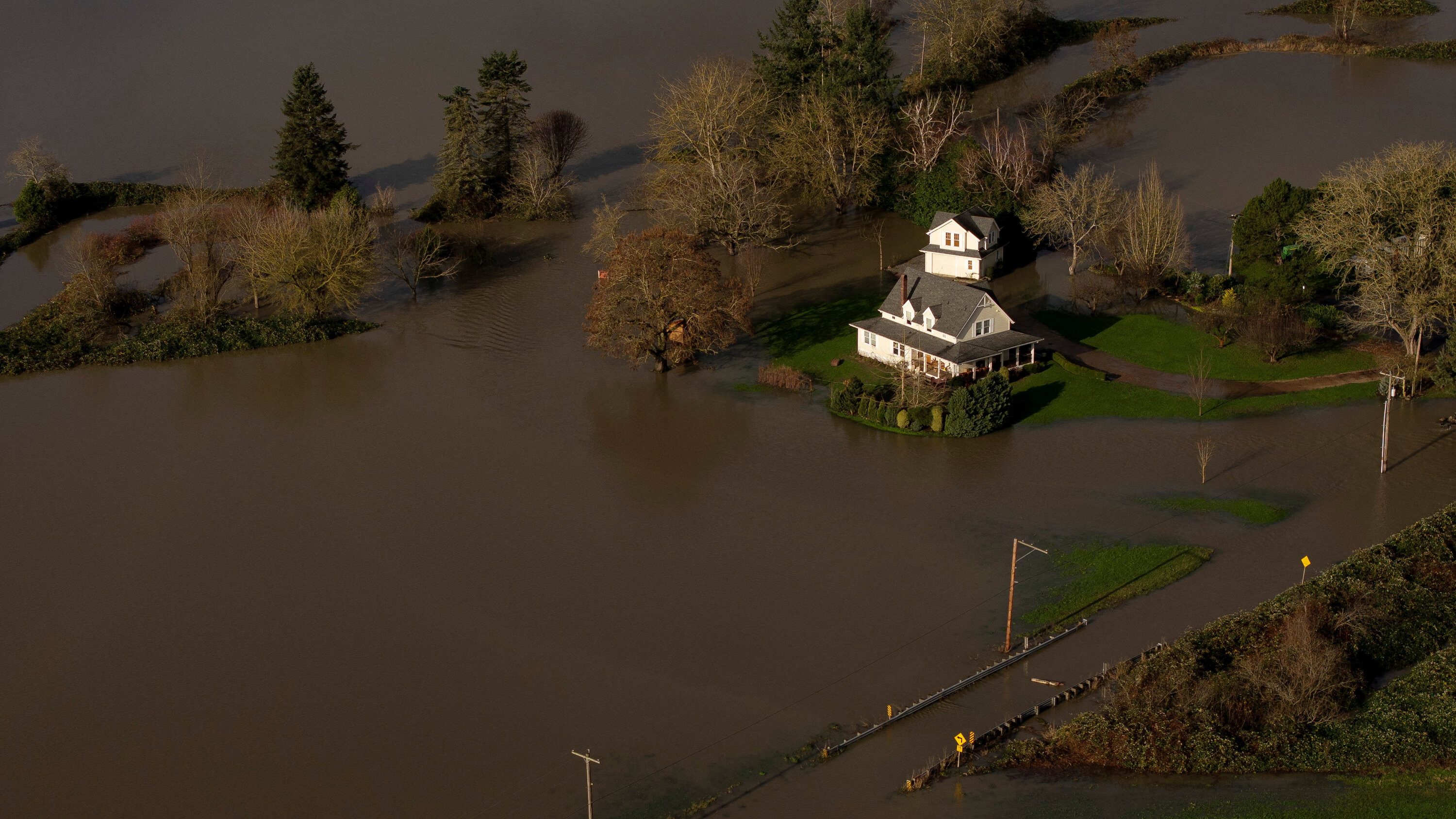 Snoqualmie River flooding near residential properties in the Snoqualmie Valley - seasonal flood risk